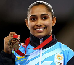 Portrait of Dipa Karmakar holding a medal