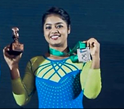 Portrait of Pranati Nayak holding a medal and trophy