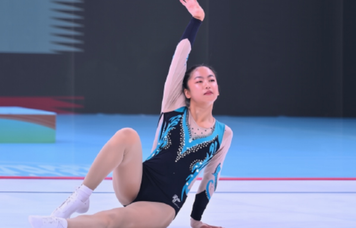 Ariha Pangambam performing her aerobic routine on the competition floor
